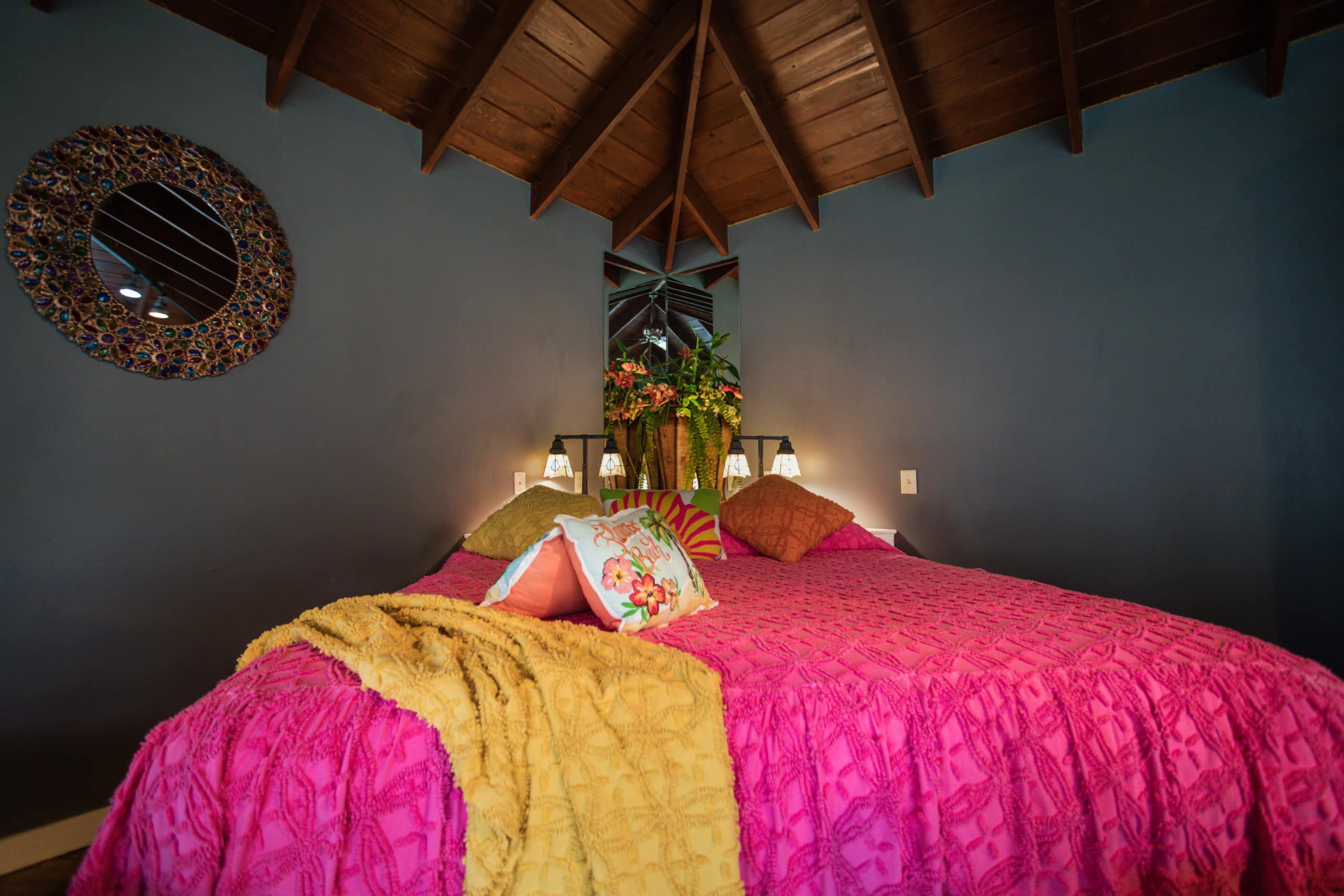 rivers-bend-cabin-02-romantic-retreat-bedroom-diagonal-view-pink-blanket-scaled